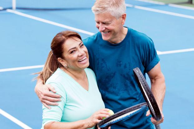 Couple on the tennis court.