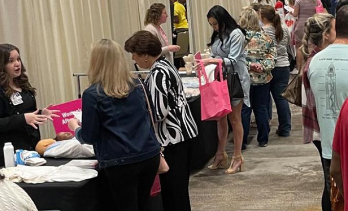 group at event exhibitor tables