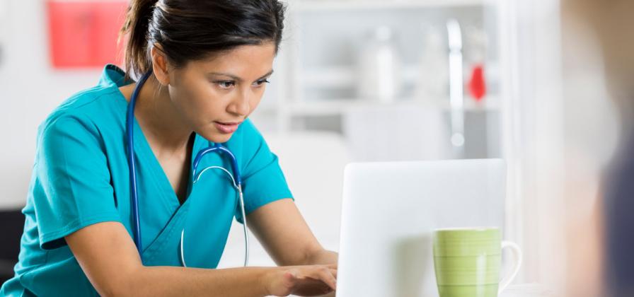 Medical professional working on computer
