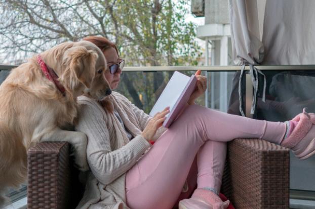 Reading a book with a dog